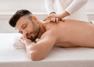 Relaxed man having manual therapy session at spa