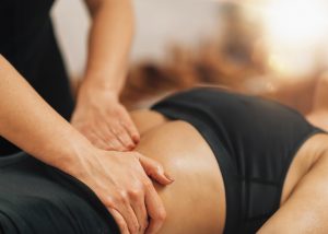Stomach Massage. Therapist Massaging Female Abdomen